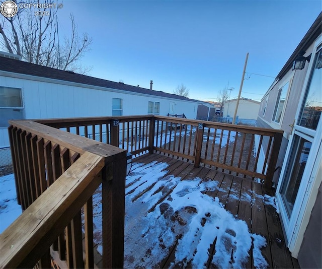 view of snow covered deck