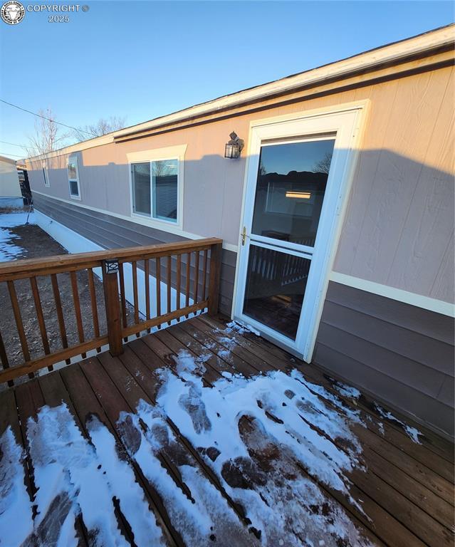 view of snow covered deck