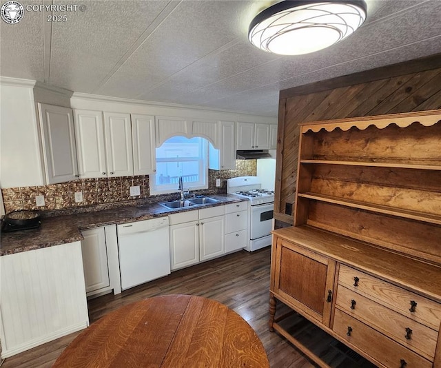 kitchen with white cabinetry, sink, white appliances, and dark hardwood / wood-style flooring