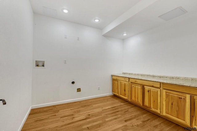 laundry room with hookup for a washing machine and light hardwood / wood-style floors