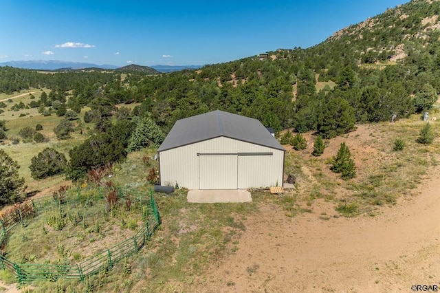 birds eye view of property with a mountain view