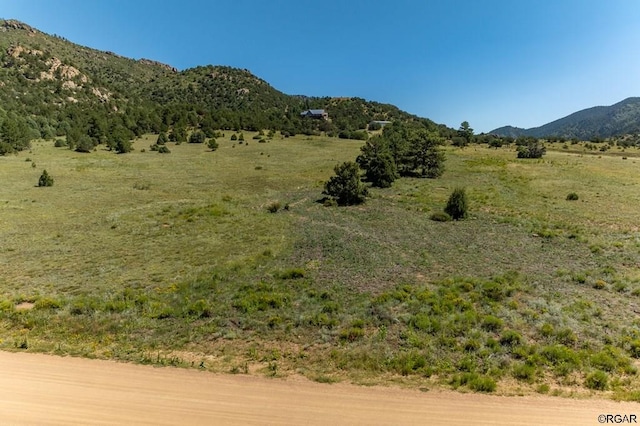 view of mountain feature with a rural view