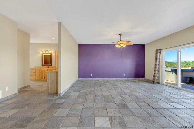 spare room featuring ceiling fan