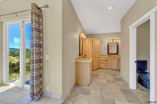 bathroom with a healthy amount of sunlight and vanity