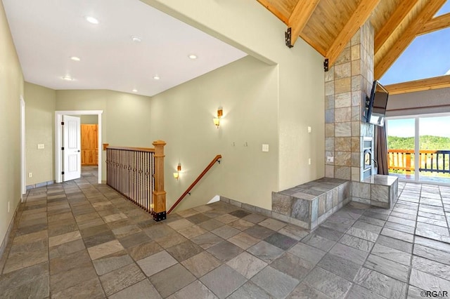 interior space with beamed ceiling, high vaulted ceiling, and wooden ceiling