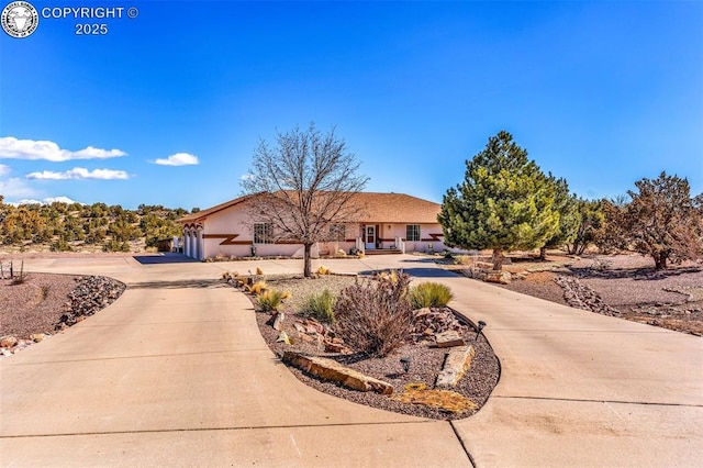 single story home featuring stucco siding