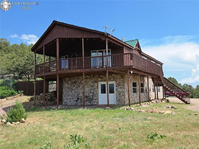 612 Lowry Ln, Canon City, CO 81212 - rear view of property with a wooden deck, stairs, and stone siding