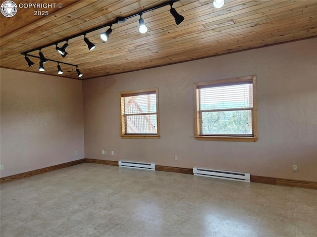 612 Lowry Ln, Canon City, CO 81212 - unfurnished room featuring track lighting, baseboard heating, and wooden ceiling