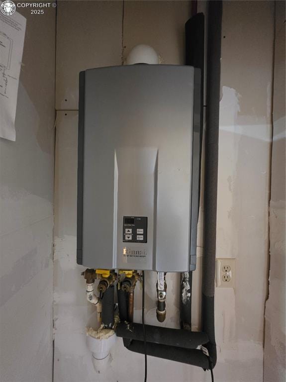 612 Lowry Ln, Canon City, CO 81212 - utility room featuring tankless water heater