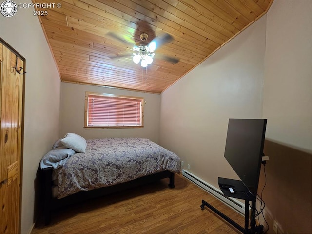 612 Lowry Ln, Canon City, CO 81212 - bedroom featuring wooden ceiling, a baseboard heating unit, vaulted ceiling, wood finished floors, and ceiling fan