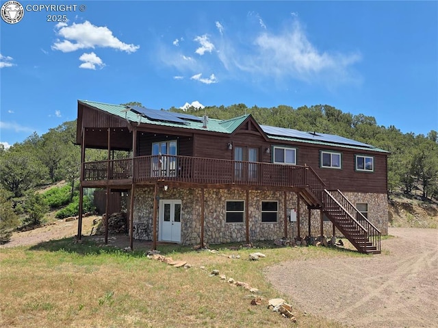 612 Lowry Ln, Canon City, CO 81212 - back of house with french doors, a deck, stone siding, and stairway