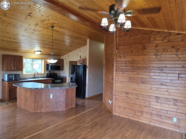 612 Lowry Ln, Canon City, CO 81212 - kitchen featuring black appliances, wood ceiling, lofted ceiling, a ceiling fan, and wooden walls