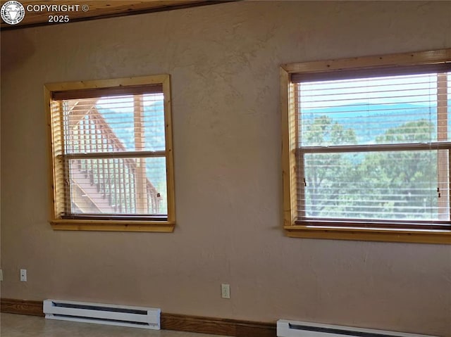612 Lowry Ln, Canon City, CO 81212 - empty room with a baseboard radiator, baseboard heating, and plenty of natural light