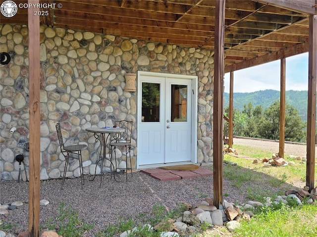 612 Lowry Ln, Canon City, CO 81212 - view of exterior entry featuring stone siding and a mountain view