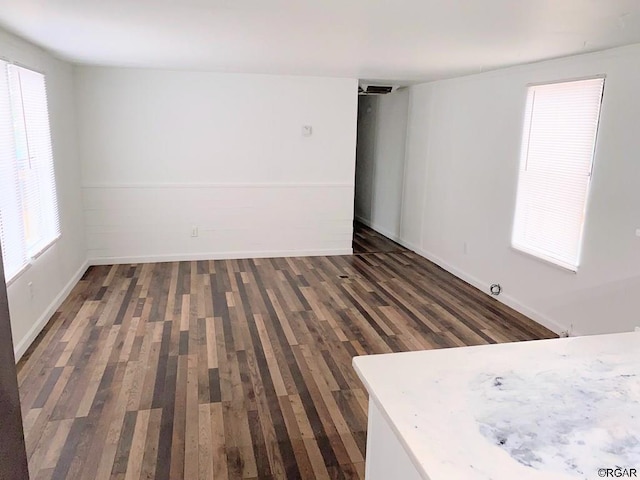 unfurnished room with dark hardwood / wood-style floors