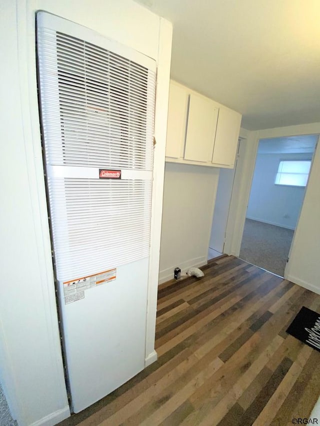 laundry room featuring dark wood-type flooring