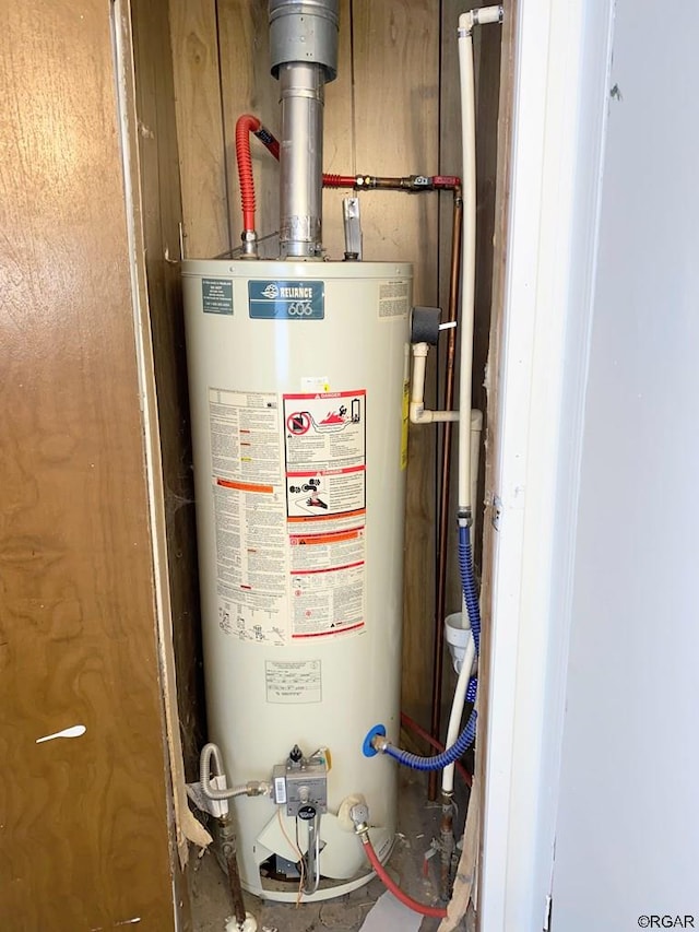 utility room featuring gas water heater