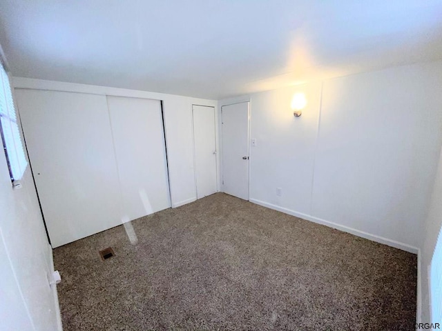 unfurnished bedroom with carpet floors