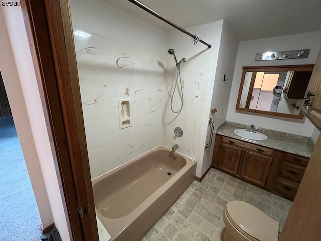 full bathroom featuring toilet, vanity, and bathtub / shower combination