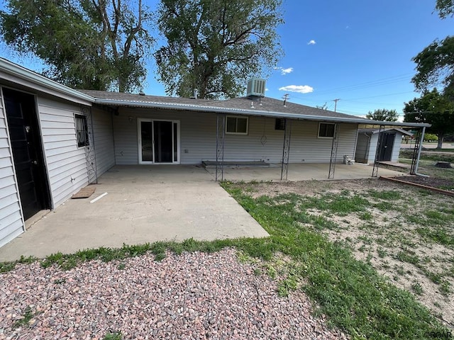 back of house with a patio area and central air condition unit