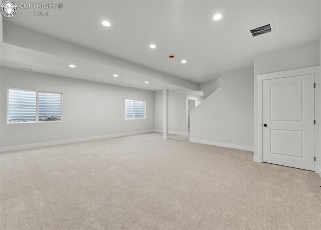 basement with light colored carpet