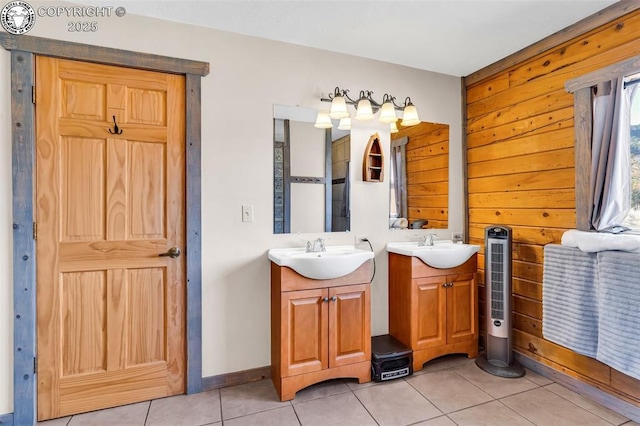 bathroom featuring tile patterned floors, vanity, and wooden walls