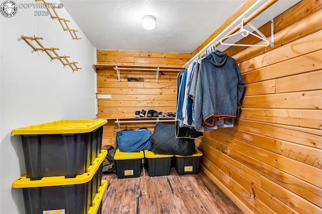 spacious closet featuring hardwood / wood-style floors