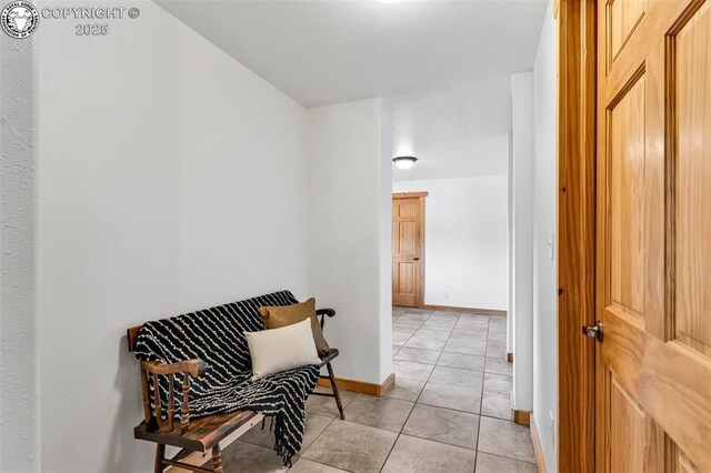 living area with light tile patterned floors