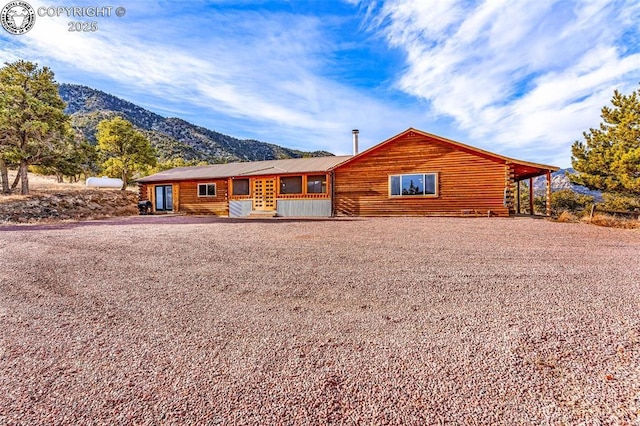 log-style house featuring a mountain view