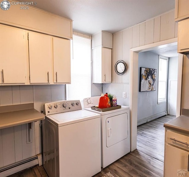 2723 3rd Ave, Pueblo, CO 81003 - laundry area featuring dark wood-style floors, washer and dryer, baseboard heating, and a baseboard heating unit