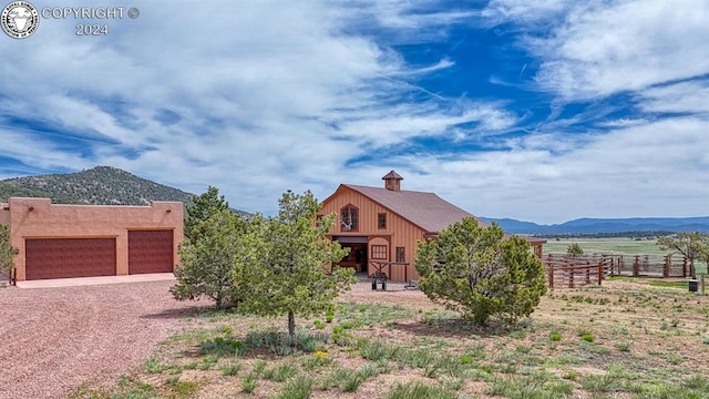 exterior space featuring a mountain view and a garage