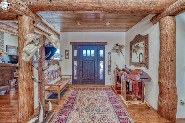 entrance foyer with hardwood / wood-style flooring and wood ceiling