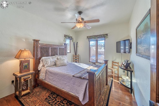 bedroom featuring wood-type flooring and ceiling fan