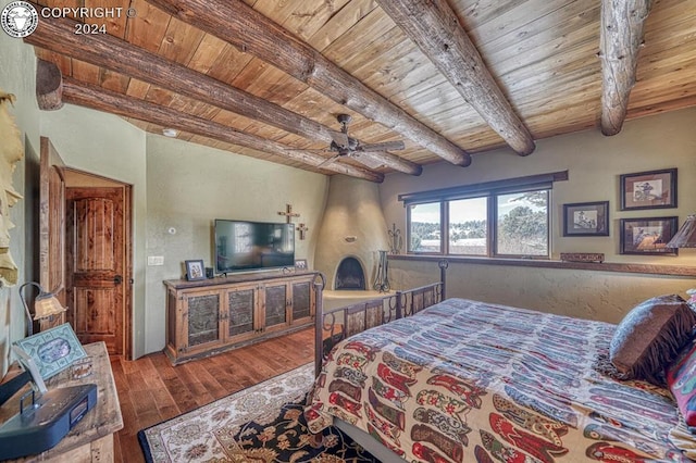 bedroom with wood ceiling, ceiling fan, beam ceiling, and hardwood / wood-style flooring