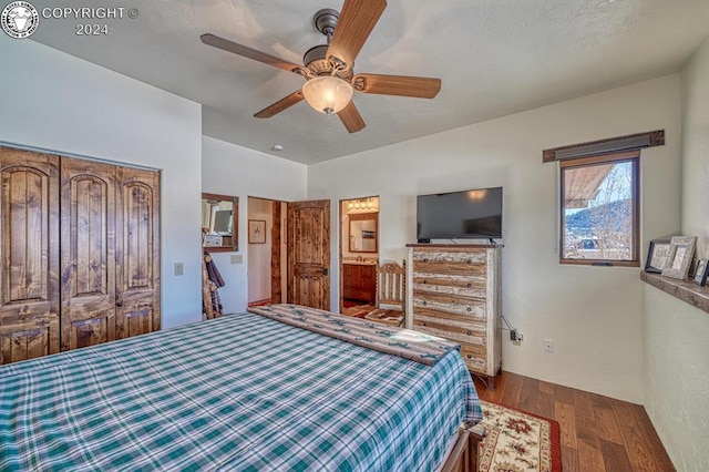 bedroom featuring wood-type flooring, ceiling fan, and a closet