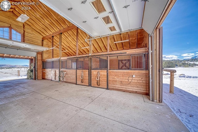 view of horse barn featuring a mountain view