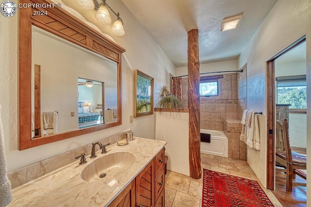 bathroom with vanity, a textured ceiling, and shower / bath combo with shower curtain