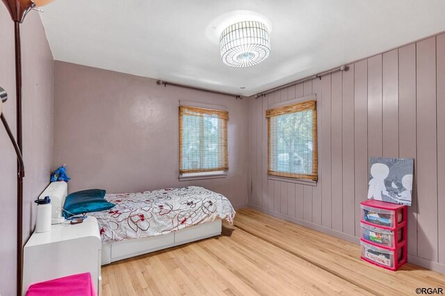 bedroom with wood-type flooring