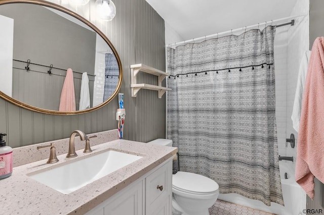 full bathroom featuring vanity, tile patterned floors, toilet, and shower / tub combo with curtain