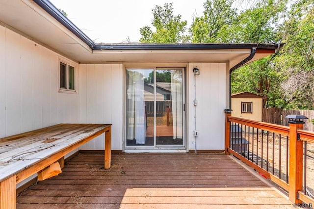 wooden terrace with a storage unit