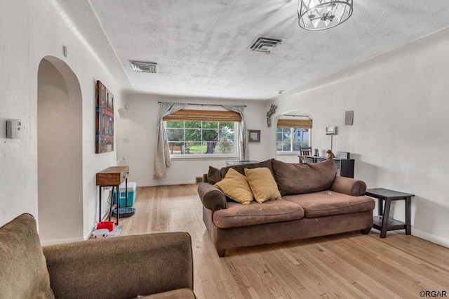 living room with light hardwood / wood-style flooring