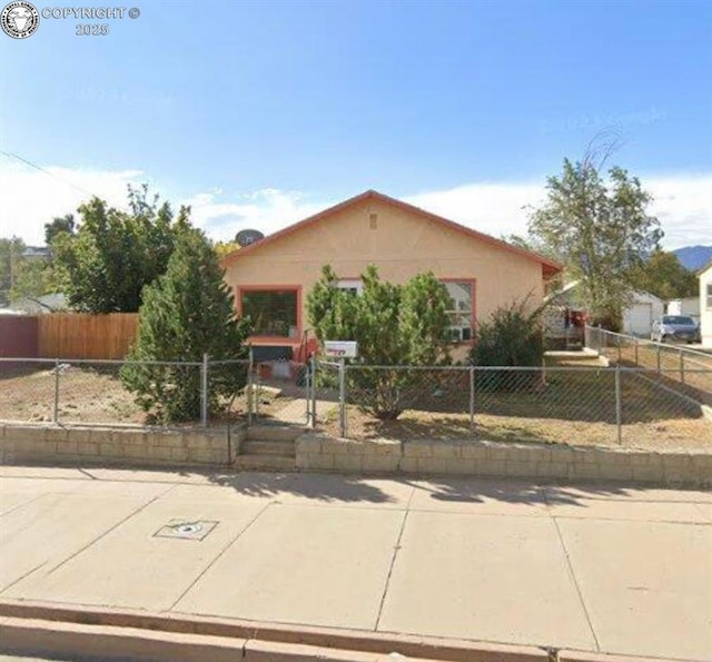 529 W Main St, Florence, CO 81226 - view of front of house with a fenced front yard