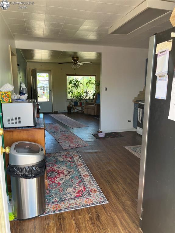 529 W Main St, Florence, CO 81226 - living area with wood finished floors and ceiling fan