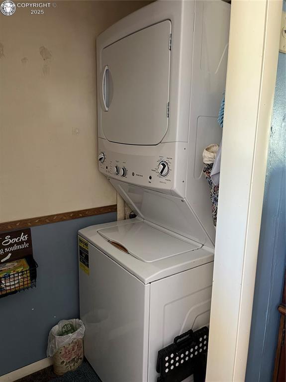 529 W Main St, Florence, CO 81226 - washroom featuring stacked washer / drying machine