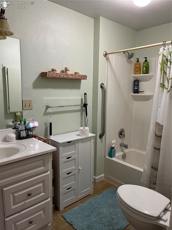 529 W Main St, Florence, CO 81226 - full bath featuring shower / tub combo with curtain, vanity, and toilet