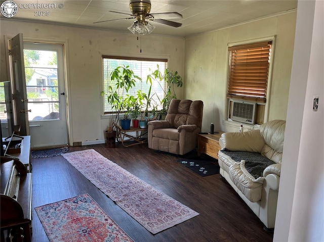 529 W Main St, Florence, CO 81226 - living room with wood finished floors, cooling unit, a ceiling fan, and crown molding