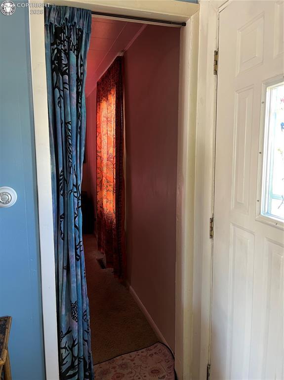 529 W Main St, Florence, CO 81226 - hallway featuring carpet floors