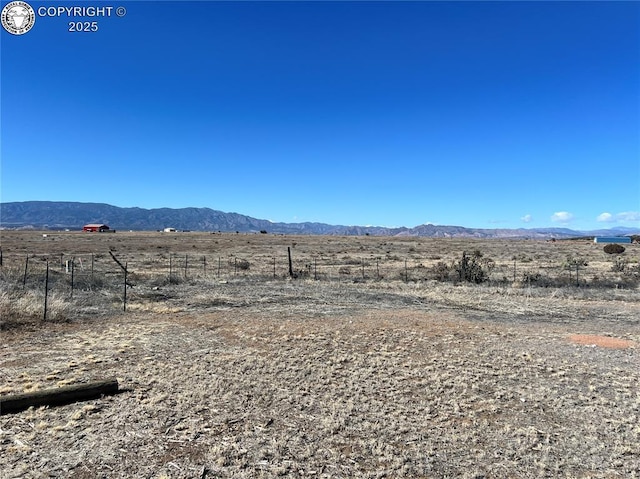 property view of mountains featuring a rural view