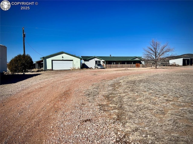 ranch-style home featuring driveway and a garage