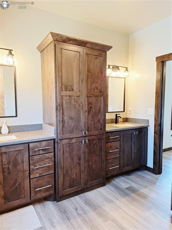 201 Fox Run, Silver Cliff, CO 81252 - full bathroom featuring wood finished floors and vanity